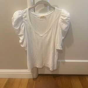 White woman’s medium short sleeve with puffy shoulder